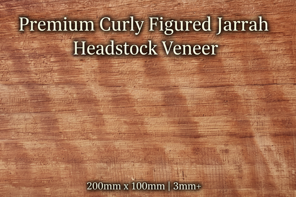 Premium Curly Figured Jarrah guitar headstock veneer showing spectacular curly figure and rich reddish-brown colouration, 200mm x 100mm, minimum 3mm thickness